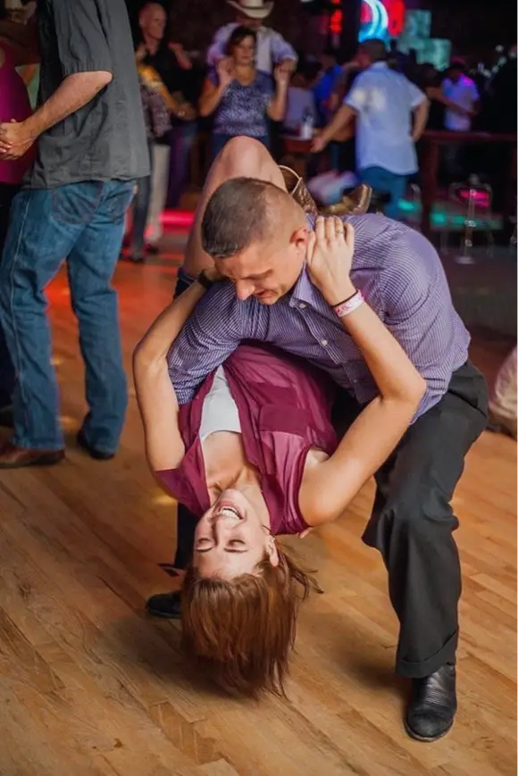 A couple taking beginner dance classes for adults